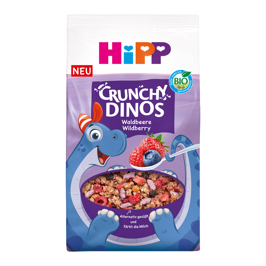 Син динозавър, който държи купа с хрупкави зърнени храни с горски плодове.